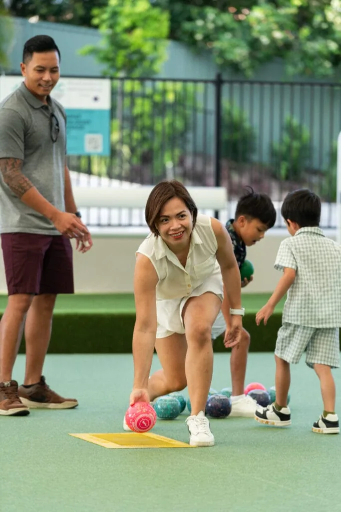 Family enjoying barefoot bowls